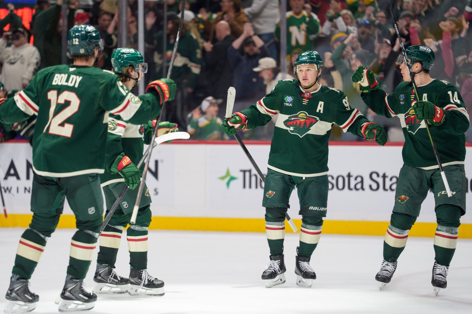 Feb 2, 2026; Saint Paul, Minnesota, USA; Minnesota Wild left wing Kirill Kaprizov (97) is congratulated by teammates for scoring the game winner in overtime against the Montreal Canadiens at Grand Casino Arena. Mandatory Credit: Matt Blewett-Imagn Images